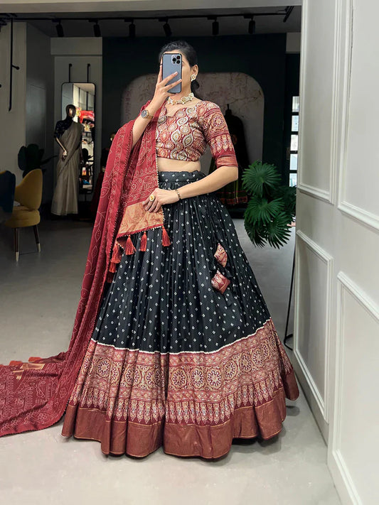 BLACK COLOR BANDHANI AND AJRAKH PRINT WITH FOIL WORK DOLA SILK CHANIYA CHOLI