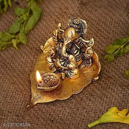 Metal Ganesh ji on Leaf with Diya Idol Showpiece for Home Décor and Diwali Gift